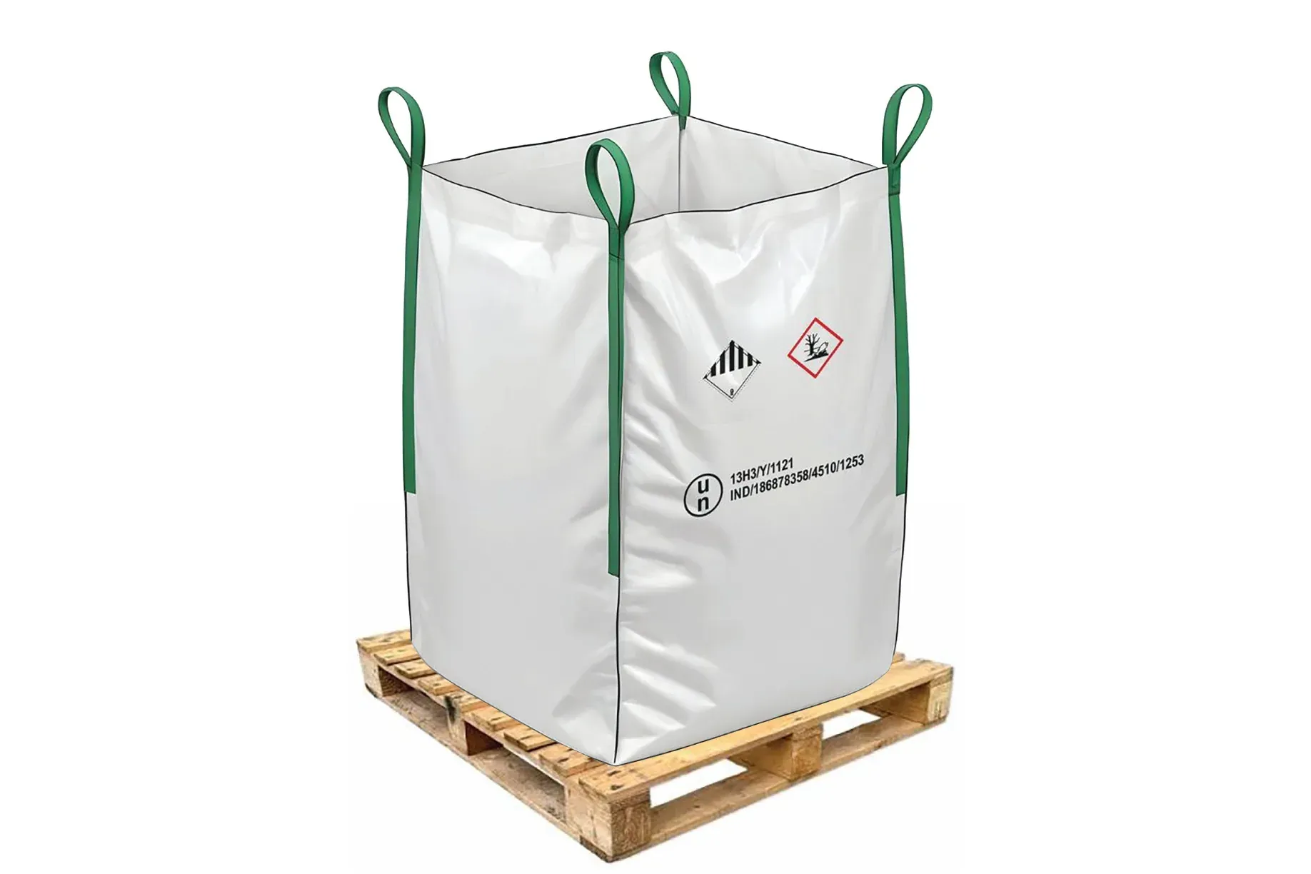 White UN rated hazmat bulk bag with green lift loops standing on a wooden pallet